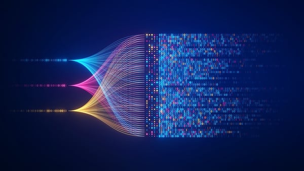 three colored streams of light transforming into computer code