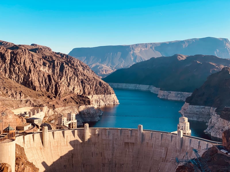 Agile workflow - image shows a dam blocking the flow of water against a backdrop of rocks and a blue sky